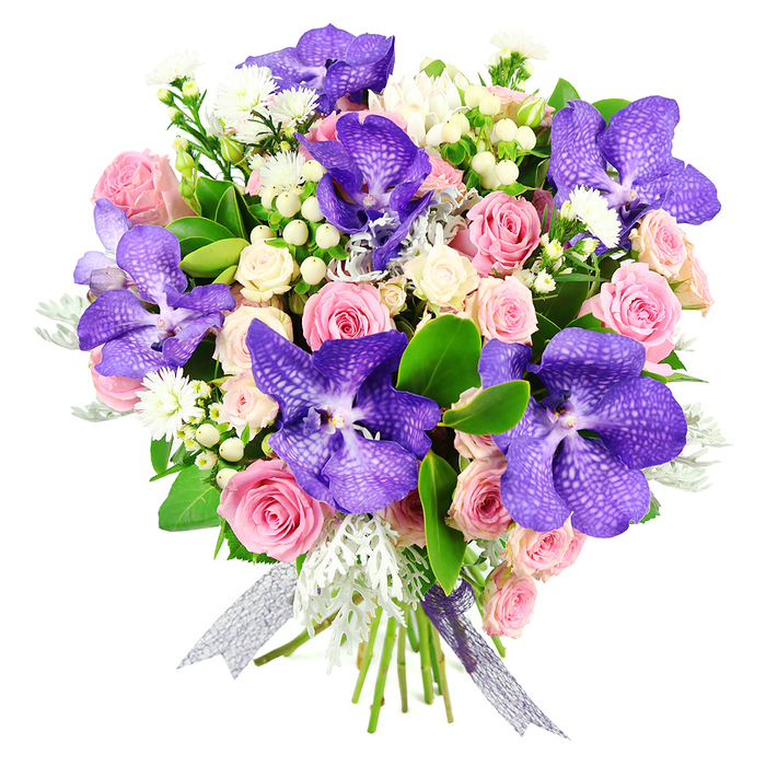 Presented against a simple white background, this hand-tied bouquet becomes the clear focal point, its colours and textures standing out with calm confidence. Central to the design are several large Vanda orchids, whose broad petals are saturated in deep violet and indigo tones, patterned with delicate speckles that resemble fine lacework. These orchids lend an unmistakably exotic touch, creating a rich contrast with the surrounding roses. Soft pink roses provide the main body of the arrangement, their petals unfolding from tight buds into open, cupped blooms that layer upon one another in plush, velvety spirals. Nestled amongst them, creamy white spray roses form clusters of smaller blossoms, adding softness and a sense of fullness that feels both generous and refined. Punctuating this floral tapestry are small, round white hypericum berries, which catch the light with a gentle sheen, and airy clusters of tiny white filler flowers that drift between the larger heads, bringing a light, almost cloud-like quality. Silvery-grey dusty miller leaves slip in and out of view, their softly textured, frosted foliage creating a cool contrast to the warmth of the pinks and purples and echoing the muted tones of early morning skies above Highgate Hill. The entire arrangement is supported by glossy dark green foliage, which frames the flowers and adds depth and structure. At the base, the stems are securely tied with a semi-sheer, shimmering ribbon in complementary silver and purple hues, its subtle iridescence linking the colours of the orchids with an elegant finishing touch. Evoking feelings of modern romance and quiet celebration, this bouquet would be perfectly at home delivered to a period flat near Highgate Village or a contemporary apartment by Archway, honouring anniversaries, birthdays, or cherished moments with understated luxury.