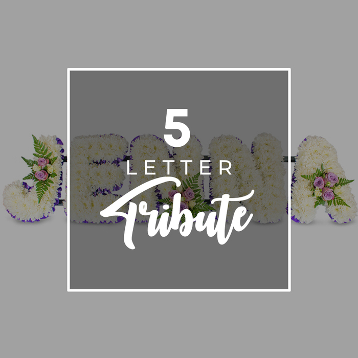 A delicately arranged five-letter funeral tribute is laid out on a pale grey surface, the neutrality of the background chosen to keep attention firmly on the floral artistry. Each individual letter is carefully shaped and entirely covered with pristine white chrysanthemums, the small, ruffled heads pressed close together so that they create a soft, seamless texture-like a snow-white blanket seen from the vantage of Highgate's higher streets on a winter's day. Tracing the outer edge of each letter is a band of deep purple satin ribbon, its rich hue and smooth, light-catching finish providing both contrast and structure, helping each character stand out with clarity and poise. At select points along the arrangement, the white chrysanthemum base is lifted by delicate clusters of flowers and greenery: pale pink and mauve roses are tucked among light, feathery ferns and shiny green foliage, introducing a gentle play of colour that feels warm and human, reminiscent of the tender planting around Highgate's historic churchyards. Set over the centre of the composition is a square overlay panel in a slightly darker shade of grey, framed in white. On this panel, the wording 5 LETTER appears in crisp, white capital letters, with the word Tribute elegantly scripted just below. The overlay partially conceals the floral letters, which appear to read J, O, H, N and an A, suggesting the tribute's capacity for bespoke personalisation, whether to spell a first name or a short, meaningful word. The atmosphere conveyed is one of quiet dignity and heartfelt remembrance, like a custom arrangement designed by Flowers Highgate for a family service, where personal touches and local care matter deeply.