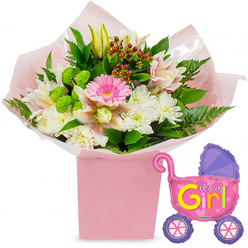 This image captures a joyful new baby girl arrangement, set against a clean white background that allows the pastel colours and playful details to shine, much like a sunny morning in Highgate Village. At its heart is a generous bouquet of fresh flowers, carefully arranged in a tall, square, light pink gift box. Soft pink tissue paper spills delicately over the edges, with a clear cellophane wrap adding a gentle sheen and holding the stems securely in place. Rising from this base is a carefully balanced selection of blooms. A vivid pink gerbera daisy forms the central focal point, its large, flat flower head composed of symmetrical petals radiating from a darker centre. Around it, white chrysanthemums gather in soft clusters, each blossom made up of many narrow petals that create a plush, rounded shape. Complementing them are alstroemeria lilies in shades of pale pink and white, their petals lightly speckled and striped, adding a note of fine detail and elegance. A closed yellow lily bud or two emerge just above the main body of the arrangement, hinting at future blooms and the unfolding days with a newborn baby. Dotted among the flowers are small lime-green button-style blooms, along with deep red hypericum berries that bring a touch of warm, berry richness. Dark green foliage, including broad leaves and airy fern fronds, frames the flowers and enhances the bouquet's full, natural outline. To the right side, a metallic foil balloon shaped like a traditional baby stroller completes the composition. The balloon's body is a bright, reflective pink, with a purple hood and purple wheels decorated with cheerful, multi-coloured spokes. Clearly visible across the side of the pram, bold yellow and green lettering reads "It's a Girl!", accented by tiny pink hearts. Together, bouquet and balloon create a tender, celebratory scene ideal for baby showers, hospital deliveries, or homecomings in the Highgate area.