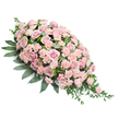 Set against a pure white background, this elongated sympathy spray draws the eye from its generously rounded head at the upper left to a fine, tapering point at the lower right, embodying the classic casket spray silhouette. The entire visible surface is densely carpeted with blossoms, primarily soft pink roses and light peach-pink carnations, arranged in a way that leaves no visible gaps. The roses, with their velvety petals unfolding in layered spirals, display tones of blush, dusty rose, and gentle pastel pink, evoking tenderness and remembrance. Interspersed among them, the carnations lend a contrasting texture; their ruffled petals and compact heads create a plush, almost quilted effect, adding depth and richness to the overall design. Encircling and supporting these blooms is an abundance of dark green foliage. Broad, ovate leaves provide a strong, polished frame that outlines the shape, while more slender, trailing greenery peeks out from the edges and cascades slightly from the pointed tip, lending the spray a sense of natural softness and movement. The overall palette of muted pinks against deep greens feels serene and contemplative, perfectly suited to a funeral service or memorial gathering in Highgate, whether in a local chapel or overlooking the historic gravestones nearby. The arrangement seems to capture a moment of stillness and respect, as if crafted by a florist attuned to the calm, tree-lined streets and quiet corners of the area. It serves as a visually gentle yet emotionally resonant tribute, ideal for families who wish to honour a loved one with flowers that speak softly of love, solace, and enduring connection.