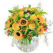 Glowing with the golden brilliance of summer days in Highgate, this spirited bouquet seems to capture the essence of sunshine itself. Warm, generous sunflowers with dark, velvety centres anchor the bouquet, their vivid petals radiating an infectious cheer. Tucked among them, buttery yellow roses spiral softly open, carrying the gentle promise of celebration familiar to the elegant homes on Muswell Hill Road. Scattered accents of orange blooms and glossy red berries dance against a backdrop of fresh, airy ferns-a playful mix that echoes the lively colours of Highgate's artisan shops. Delicate greenery peeks between the blooms, adding layers of texture and evoking a gentle breeze drifting through Queen's Wood. The clear, rounded glass vase displays the natural tangle of stems, reinforcing the design's relaxed artistry and open character. The fragrance, fresh and lightly sweet, hints at a walk through local flower gardens after rain. Designed by Flowers Highgate to brighten birthdays, offer thanks, or simply deliver a burst of happiness, this arrangement brings a vivid splash of the neighbourhood's spirit into any setting.
