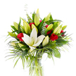 A luminous studio portrait of a tall, carefully balanced bouquet set in a simple cylindrical clear glass vase, the composition captured against a clean, bright white backdrop that makes every colour read with clarity. At its centre a single, fully open creamy white oriental lily commands attention; its smooth, waxy petals curve back to reveal pale yellow stamens and a soft, light green pistil, a serene focal point that feels almost sculptural. Around this open bloom, a chorus of lime-green and soft yellow lily buds sits at varying stages of unfurling, their clustered shapes bringing a sense of promise and unfolding life. Scattered through that pale architecture are small clusters of velvety red rosebuds - petals tightly curled, their deep crimson providing a classic, romantic counterpoint to the lilies' purity. The flowers are set into a generous framework of foliage: broad, dark forest-green leaves give structure and shadow, long feathery palm-like fronds in a lighter emerald spill outward to suggest motion, and rounded silvery eucalyptus leaves add a cool, matte contrast. Through the glass vase the stems read as crisp, leafy columns submerged in clear water, the light catching faintly on the surface. The whole piece breathes of freshness and calm; you can imagine the soft, heady perfume of lilies tempered by the richer, warmer note of roses. As a Highgate florist's composition, it feels fitting for an intimate anniversary, a heartfelt congratulations, or as a composed centrepiece for a quiet celebration in a Hampstead or Highgate home, carrying an air of elegant sympathy, devotion, and understated joy.
