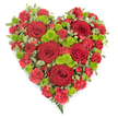 A beautifully composed, heart-shaped flower tribute designed for a funeral or remembrance is shown against a clear white background, its red and green palette immediately drawing attention. The heart is densely packed so that the flowers form a continuous, velvety surface with no empty spaces, symbolising completeness and devotion. Dominating the design are lush red roses, each flower displaying tightly curled central petals that gradually loosen and open toward the edges, creating pockets of shadow and light across the arrangement. Nestled closely around these feature blooms are countless small red carnations and mini carnations, their ruffled petals overlapping in soft layers that lend the heart a quilted, almost fabric-like texture in rich crimson hues. Bright lime-green button chrysanthemums are dotted throughout, their small, rounded heads and fine, compact florets creating a lively contrast that brightens the composition and guides the gaze around the heart. Along the outer contours, small sprays of variegated foliage-green leaves tipped with creamy white-frame the floral mass, gently accentuating the curves, while a slender fern frond trails from the pointed base like a quiet flourish. The result is a balanced, elegant piece that feels both strong and tender, well suited to a final farewell in Highgate, whether placed beside the coffin or on a memory table during a service. The intense red tones suggest deep, unwavering love and gratitude, while the cooling green accents bring a sense of peace and gentle remembrance, offering comfort to those gathered to say goodbye.