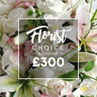 From the vantage of a long-time Highgate florist, this vibrant close-up captures a Florist Choice Bouquet that feels like a quiet celebration in white. Dominant blooms are white roses, in various stages of opening, paired with white lilies whose inner petals bear a gentle pink blush. Pink-tinted accents peek between the blooms and are echoed by small clusters of pale pink flowers, while eucalyptus-like greenery threads through to anchor the composition with natural ease. The frame is alive with light, and the bouquet seems to glow with fresh morning air.

A central white overlay sits with a light border, announcing the bouquet with readable clarity. The script for Florist leads into a bold uppercase for CHOICE BOUQUET, then the price cue and the digits ?300, all displayed in crisp white to stand against the blossoms. The effect is both informative and artistic, a hallmark of premium, handmade floristry.

Viewed close-up, the textures invite touch: the satin-soft petals of the roses, the lacquered sheen of lily petals, the fragile translucence of the pink blossoms, and the airy spread of eucalyptus fronds. The bouquet reads as a celebration of freshness and elegance, designed to communicate care and thoughtfulness even before the message is opened by the recipient.

Locally, this Florist Choice Bouquet would suit celebrations large or small, from milestone birthdays to heartfelt sympathies. The arrangement is crafted with care in a north London studio, offered with reliable service and same-day delivery to doorsteps across Highgate and neighboring districts, delivering a touch of refined grace to the lives of your loved ones.