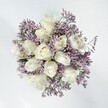 Serene and enchanting, this Highgate-inspired bouquet brings together creamy white roses and gentle lavender statice, resonating with timeless elegance. Each rose is lush and inviting, its petals gradually unfurling to reveal a tender core, while the statice winds through in wispy lavender clusters, evoking the soft haze of early morning along Highgate's meandering paths. The bold chalk-white blossoms are balanced by the delicacy of the surrounding lavenders, offering both visual purity and tactile intrigue-the velvety roses paired with crisp, feathery accents. In natural light, the palette feels fresh and hopeful, ideal for expressing love and new beginnings, be it a wedding, anniversary, or just because. Subtle scent-clean, green, and barely floral-gently refreshes the room, reminiscent of blooms carried on the breeze at Waterlow Park. Carefully composed by local Highgate florists, this arrangement conveys heartfelt sincerity, comfort, and the quiet beauty of life's special occasions in the heart of this historic neighbourhood.