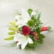 Arranged with the same thoughtful care found in Highgate's best-loved florists, this bouquet rests on an off-white, textured surface that echoes the calm of local parks and terraces. Its visual story is led by a sweeping cluster of pristine white lilies, some in lavish bloom with gently curved petals, others tight as green buds-each symbolising hope and new beginnings. A single velvety red rose emerges from the centre, its rich crimson a classic homage to romance, sharply defined against the bouquet's lighter hues. Adding unique character, vibrant mossy green balls-Green Trick Dianthus-peek between lilies, enhanced by sprays of delicate white baby's breath that cast an airy veil over the arrangement. Contrasts abound with scattered clusters of glossy red hypericum berries, lending a cheerful, natural pop reminiscent of the lively colours found in Highgate's weekly markets. Lush, deep green foliage in varied forms wraps around the bouquet-soft feathery fronds alongside broader, glossier leaves-providing texture and organic structure. The whole arrangement is elegantly gathered with a bold red satin ribbon that unites the composition. Dynamic yet harmonious, this bouquet is equally suited for wedding celebrations, heartfelt anniversaries, or meaningful same-day deliveries throughout Highgate, Muswell Hill, and beyond-invoking a sense of love, artistry, and local charm with every bloom.