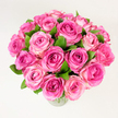 A lush bouquet of roughly two dozen pink garden roses sits in a clear glass vase, captured against a clean white background under soft, even light. Each bloom is open or nearly open, the petals forming layered spirals that move from a deep, fuchsia-pink at the heart to softer rosy and blush tones toward the outer edges, creating a natural ombré that gives depth and warmth to the arrangement. Dark green, glossy leaves are carefully interspersed among the flowers, their cool tone sharpening the sweetness of the pinks and lending a fresh, organic contrast. Photographed from a slightly elevated, overhead angle, the composition reads as a generous, rounded dome of petals-dense, velvety and inviting-so the viewer can appreciate both the individual textures and the overall silhouette. The light is diffuse and flattering, picking up the satiny sheen of each petal while keeping shadows minimal, and the faint, powdery scent of roses seems almost present through the image. As a local florist might explain when describing a delivery to someone in Highgate near the village green or a quiet Hampstead Heath walk, this bouquet feels celebratory and tender at once: ideal for anniversaries, Mother's Day, or a heartfelt thank-you. The arrangement's understated vase and the uncluttered background keep the focus squarely on the flowers' colour gradation and craftsmanship, conveying a mood of refined romance and simple joy suited to both home décor and special occasions.