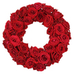 From Flowers Highgate, a lush circular wreath of deep red roses rests against a crisp white backdrop. Dozens of blooms-large, fully opened heads with velvety petals, paired with smaller, tightly furled buds-are packed tightly to form a plush, uniform crimson surface. Each rose leans into its neighbour, creating a rich texture you can almost feel under your fingertips. The petals curl in graceful spirals, catching the light and revealing subtle variations in ruby and burgundy. This timeless design speaks the language of love, admiration, and remembrance, a versatile statement for romance, anniversaries, or solemn memorials. The crisp white background isolates the wreath, letting the intensity of the colour take centre stage while the craftsmanship becomes evident in the careful spacing and layering. In our Highgate workshop, we select roses for their sturdiness and fragrance, ensuring a consistent crimson hue throughout. The soft scent of fresh petals rises as you approach, mingling with the clean air of the studio before delivery. For clients in Highgate, Crouch End, and Muswell Hill, we offer reliable same-day delivery, bringing this piece of floral artistry to doorsteps. This wreath is more than decoration; it is a circle of devotion, a statement piece that conveys warmth and dignity, ready to symbolize enduring affection or heartfelt sympathy.