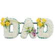 A deeply reverent floral tribute spells the word DAD in three large, freestanding capital letters, each letter lovingly built from a dense, pillowy blanket of pristine white spray chrysanthemums that read as soft, cloud-like texture. The edges of every letter are carefully traced with a ruffled, dark emerald satin ribbon that gives a crisp, refined border against the pure white blooms, catching the light with a faint satin sheen. Thin, dark green metal support bars run horizontally behind the letters, connecting and stabilising them so the composition reads as a single cohesive memorial display. On the left-hand 'D' a lively cluster of 3-4 sunlit yellow roses is placed on the upper left curve, their open faces suggesting warmth and remembrance; they are nestled with small white freesias or gypsophila and fresh green foliage, and two long, slim green stems arch diagonally toward the central 'A' like a quiet, graceful reach. The centre 'A' bears a tasteful, intimate cluster on its lower left diagonal: two deep purple, trumpet-shaped calla lilies form an elegant, formal focus, their velvety sheen and sculpted curves offering dignity and solemn beauty alongside tiny white filler blooms. The right-hand 'D' mirrors the left with an identical cluster of bright yellow roses and soft white accents on its upper right curve, completing a balanced, symmetrical tribute. The overall effect is one of gentle contrast-pure white florals framed by rich green, brightened by yellow optimism and anchored by the deep, contemplative purple of the callas. Presented against a clean white background, this arrangement radiates quiet comfort and is crafted with the care a Highgate family would choose for a father's funeral or memorial service, evoking calm, scent of fresh blooms, and respectful remembrance.