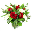 A refined bouquet of red roses and white calla lilies stands in a simple clear glass vase, photographed against a pure white background that brings its vivid colours and elegant lines into sharp relief. At its heart, six or seven red roses bloom fully, each one richly saturated in crimson, with velvety petals curling in tight, intricate spirals that draw the eye inward and convey a sense of intense, enduring affection. Interwoven among these romantic blooms, several white calla lilies rise with sculptural poise, their smooth, trumpet-shaped petals arching upwards and outwards, exposing slender yellow spadices that glow gently within the creamy white. The arrangement is generously cushioned by mixed greenery: rounded eucalyptus leaves in cool, silvery-green tones add a soft, feather-light touch, while larger, darker green leaves form a lush, structured frame, enhancing the bouquet's full, rounded silhouette. The cylindrical vase reveals neatly gathered stems immersed in clear water, and a subtle ribbed ring at the base adds a hint of texture as it catches the light. Bright, even illumination washes over the entire composition, heightening the contrast between the deep reds, pristine whites, and layered greens, and giving the flowers a freshly arranged appearance, as if they have just been prepared for delivery from a Highgate florist to a townhouse near Dartmouth Park or a stylish apartment close to Archway Road. The mood is quietly luxurious and deeply romantic, perfect for anniversaries, Valentine's Day gestures, or any special evening when you want a bouquet that feels both modern in form and timeless in sentiment.