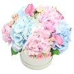 In the soft morning light that caresses Highgate's quiet streets, Flowers Highgate presents a luxurious arrangement arranged in a pristine round white hatbox. The dome is generous, a celebration in pink and blue: giant peonies in velvet blush unfold their many petals, while cloud-like clusters of baby-blue hydrangeas add airy volume. Intertwined are pale pink spray roses, their buds tucked close as whispered promises, and two trumpet-shaped calla lilies in a deeper rose hue that rise with architectural grace-one near the top-left and the other peeking from the bottom-right. A touch of greenery-dusty miller's silvery edges and hydrangea leaves-frames the blossoms with quiet depth. The composition feels opulent yet intimate, a bouquet you'd gift to mark a milestone or simply welcome love into a room.

Set against a pure white backdrop, it reads as both centerpiece and heartfelt gift, ideal for birthdays, anniversaries, baby showers, or a gender reveal. In Highgate, imagine it brightening a dining table at a home near Highgate Village or greeting visitors at the front door on a quiet Hampstead Heath dawn. The pastel palette of soft pinks and pale blues conveys romance, tenderness, and calm, while the bold peonies and sculptural calla lilies offer moments of drama within refinement.

Crafted with care by Flowers Highgate, this piece speaks to the craft of a local florist who understands the language of form and fragrance. The blooms arrive fresh, with careful wiring and a seamless dome that keeps every stem in gentle balance. For residents across Highgate, Hampstead, and the neighboring streets, delivery is available with same-day options, ensuring a moment of beauty arrives exactly when you want it. A note of affection, a celebration, or a comforting gesture-this bouquet says it all without saying a word.