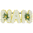 A three-dimensional, heartfelt tribute spelling out the word NAN, rendered here in bold capital letters and photographed against a clean white background. Each letter is built from a dense carpet of small, pristine white chrysanthemums - their button heads packed closely to create a soft, pillowy texture that reads almost cloud-like from a short distance. Each letter's edge is defined by a bright band of smaller yellow blooms, likely button chrysanthemums or miniature carnations, their sunny faces creating a crisp, cheerful outline that lifts the composition and catches the light. The two outer 'N' letters carry compact accent clusters of deep green foliage and tighter yellow buds tucked into the top or shoulder of each letter; the glossy leaves and ferny sprays add a cool, verdant depth and a reassuring weight to the design, while the yellow buds bring moments of focused warmth. The central 'A' remains pure in its simplicity, letting the white chrysanthemum surface and yellow border speak for themselves. A discreet dark green or black horizontal support bar runs behind the upper sections, unseen from the front yet providing stable structure for standing display at a funeral or graveside. The overall palette - clean white, joyful yellow, and rich green - conveys both respect and a gentle optimism, appropriate for remembering a beloved nan. In soft studio lighting the textures are clear: the chrysanthemums' tiny petals, the satin-like sheen of the yellow florets, and the glossy highlights on the foliage. This personalised letter tribute would sit with dignity beside a service at Highgate Cemetery or on a mantel in Highgate Village, offering a visual emblem of affection and quiet remembrance for family and friends.