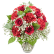 A romantic bouquet of red and white blooms is elegantly presented in a clear glass vase, photographed against a pure white background that intensifies the colours and gives the arrangement a gallery-like presence. At the centre, deep red roses claim attention, their petals still closely wrapped in refined spirals, evoking timeless love and thoughtful sentiment. Encircling them, generous red carnations open fully, their softly frilled petals layered to create rounded, plush blooms that add a feeling of generosity and warmth. Woven among the red flowers is a fine mist of white baby's breath, each tiny blossom contributing to an airy, cloud-like effect that gently breaks up the intensity of the crimson and adds a whisper of innocence. The greenery includes dark, lustrous rose leaves and rounded eucalyptus leaves with a cool, silvery-green tint, offering subtle contrast and suggesting the tranquil, leafy character of Highgate's residential streets. The bouquet has been shaped into a smooth, dome-like form, each bloom placed carefully so the design appears full and harmonious from every angle, much like the arrangements prepared for intimate dinners and small celebrations in Highgate Village. The vase itself is understated, with a slightly flared neck and solid base, allowing the viewer to see the clean stems and clear water inside, which reinforces a sense of freshness and professional floristry. Soft, consistent lighting enhances the velvety richness of the roses and the delicate ruffle of the carnations, casting gentle shadows that add depth without distracting from the main colours. The mood conveyed is intimate, celebratory, and comforting, making it well suited to anniversaries, romantic gestures, or thoughtful deliveries to friends and family around N6.