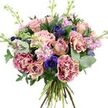 A beautifully balanced bouquet fills the image, presented against a clear white background so that every petal, leaf, and stem stands out in crisp detail. The flowers are arranged in a rounded, hand-tied form that feels both abundant and thoughtfully composed, reminiscent of a bouquet collected from a local Highgate florist for a quiet dinner or milestone celebration. At the heart, large roses in shades of dusty pink, blush, and the faintest peach open in layered spirals, with some blooms fully expanded and others still rounded and bud-like, creating an engaging mix of shapes and stages. Gathered around them are plush carnations, their ruffled, feathery petals showing soft gradients from creamy, blush-toned centres to deeper magenta and plum tips, adding texture and a sense of movement. Deep indigo and violet-blue anemones are interspersed throughout the design, their dark, almost black central eyes standing out dramatically against the surrounding pastels and lending a modern, artistic touch. Slim stems of lavender and pale pink stock weave delicately between the larger forms, each one bearing rows of tiny flowers that bring a light, airy softness and recall the gentle fragrance of cottage gardens tucked behind houses near Highgate Wood. Embracing the blooms is a carefully chosen mix of greenery: rounded silvery eucalyptus leaves introduce cool, muted tones and a hint of herbal freshness, while darker, broader foliage provides depth and a rich backdrop for the brighter petals. The natural stems are visible at the base in a neat hand-tied bundle, emphasising craftsmanship and freshness. Bathed in bright, even light, the bouquet projects a feeling of quiet celebration and refined romance, ideal for illustrating flower delivery, special occasion gifts, or elegant home styling across Highgate N6.