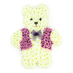 In this quietly moving image, a three-dimensional floral teddy bear sits serenely against a pure white backdrop, representing a deeply personal funeral or memorial tribute suited to the Highgate area. The bear's body is sculpted from a multitude of creamy white chrysanthemums, their small, cushion-like heads pressed closely together to create a soft, plush effect over every curve-the domed head, rounded ears, gently sloping shoulders, and plump little paws. Light and shadow dance delicately across the petal-filled surface, adding depth and making the teddy appear almost tangible, as if it might be lifted gently into a child's arms. The face is defined with dark floral details that form attentive eyes and a button nose, giving the bear a sweet, almost protective expression that feels comforting in the context of loss. Across its chest, bands of purple and mauve flowers are arranged into a neat waistcoat, complete with the impression of lapels and a central opening, the cool shades reminiscent of the heathers and wildflowers seen in parks around Highgate. Around the neck, a gossamer-like lavender mesh bow is tied into soft loops, its transparency allowing glimpses of the flowers beneath and adding a final touch of gentle elegance. With no other objects in the frame, attention rests solely on the craftsmanship and tenderness of the design. This floral teddy bear could easily be imagined at a service near Highgate Cemetery or a local church, chosen by a family wishing to honour a child, grandchild, or loved one whose memory is forever linked with innocence, warmth, and the quiet comfort of a beloved teddy bear.